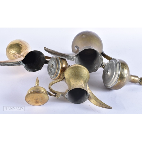 146 - FIVE ISLAMIC MIDDLE EASTERN LONG SPOUT COFFEE POT EWERS. Largest 40 cm high. (5)