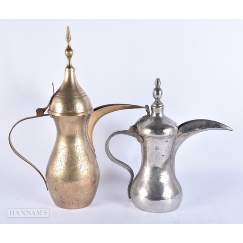 146 - FIVE ISLAMIC MIDDLE EASTERN LONG SPOUT COFFEE POT EWERS. Largest 40 cm high. (5)
