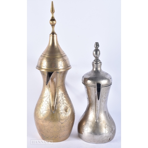 146 - FIVE ISLAMIC MIDDLE EASTERN LONG SPOUT COFFEE POT EWERS. Largest 40 cm high. (5)