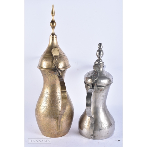 146 - FIVE ISLAMIC MIDDLE EASTERN LONG SPOUT COFFEE POT EWERS. Largest 40 cm high. (5)