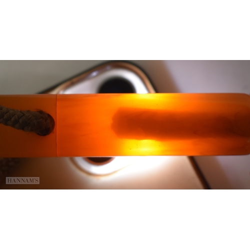 155 - A VINTAGE HONEY HANDLED PARASOL possibly amber (UNTESTED). 64 cm long.
