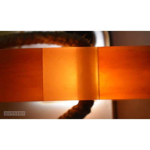 155 - A VINTAGE HONEY HANDLED PARASOL possibly amber (UNTESTED). 64 cm long.