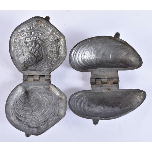 76 - TWO ANTIQUE FRENCH PEWTER CLAM SHELL ICE MOULDS. Largest 9 cm x 5.5 cm. (2)