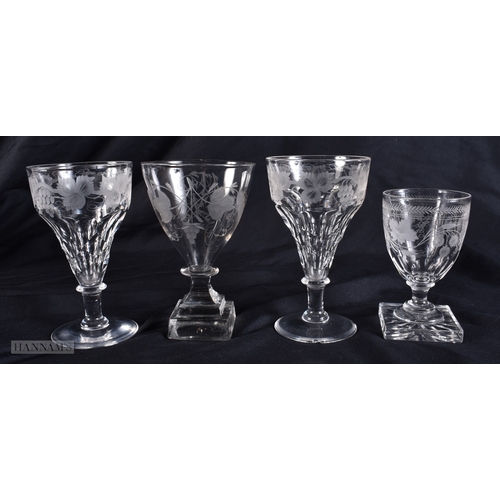 99 - FOUR ANTIQUE GLASSES all engraved with flowers and vines. Largest 12.5 cm high. (4)