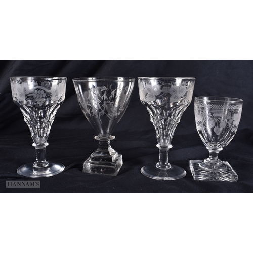 99 - FOUR ANTIQUE GLASSES all engraved with flowers and vines. Largest 12.5 cm high. (4)