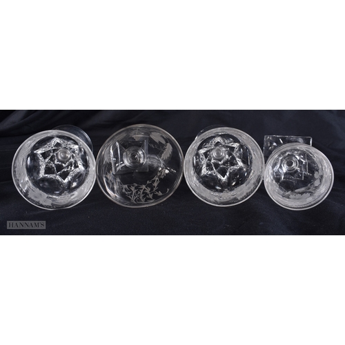 99 - FOUR ANTIQUE GLASSES all engraved with flowers and vines. Largest 12.5 cm high. (4)