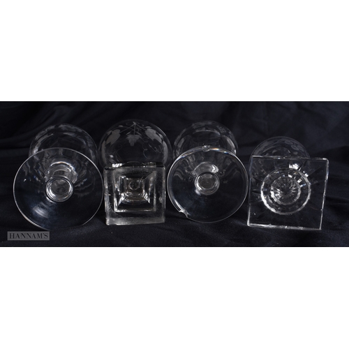99 - FOUR ANTIQUE GLASSES all engraved with flowers and vines. Largest 12.5 cm high. (4)