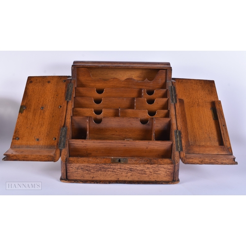 15 - A LARGE VICTORIAN OAK DESK CABINET together with a horn dinner gong. Largest 40 cm x 30 cm. (2)