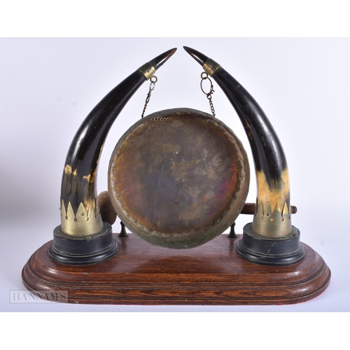 15 - A LARGE VICTORIAN OAK DESK CABINET together with a horn dinner gong. Largest 40 cm x 30 cm. (2)
