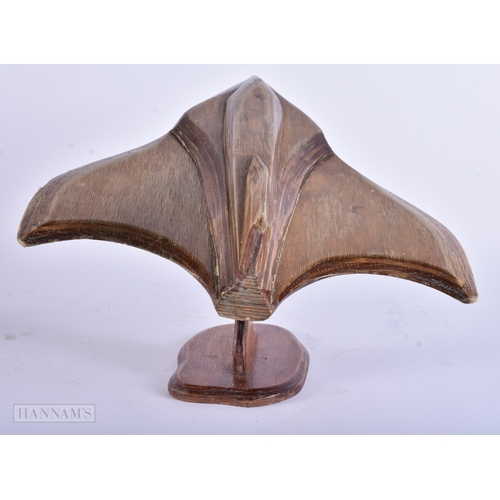 26 - A CARVED PLYWOOD STYLISED MODEL OF A PLANE. 44 cm x 26 cm.