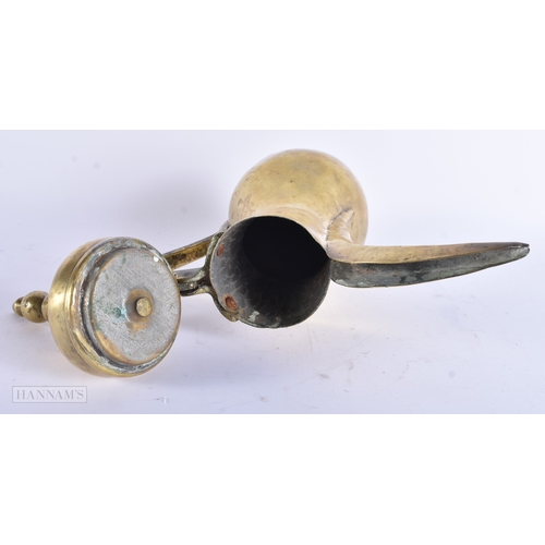 27 - AN ISLAMIC MIDDLE EASTERN BRASS COFFEE POT EWER. 32 cm x 18 cm.