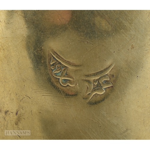 27 - AN ISLAMIC MIDDLE EASTERN BRASS COFFEE POT EWER. 32 cm x 18 cm.