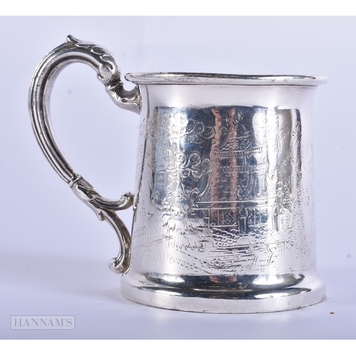 35 - AN ANTIQUE CONTINENTAL SILVER MUG engraved with Chinese scenes, together with a solid silver scoop. ... 