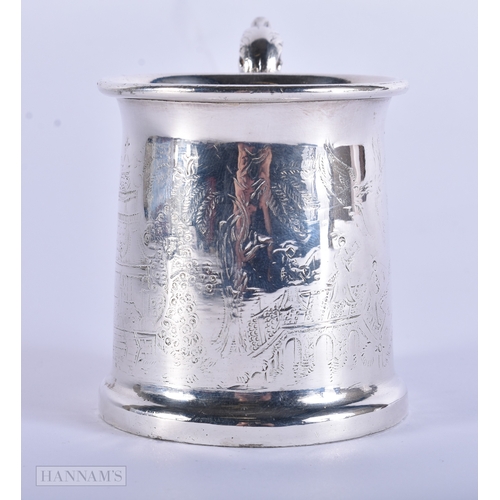 35 - AN ANTIQUE CONTINENTAL SILVER MUG engraved with Chinese scenes, together with a solid silver scoop. ... 