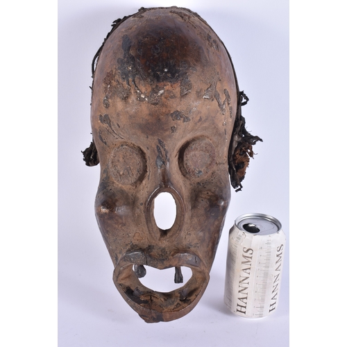 356 - AN UNUSUAL AFRICAN TRIBAL CARVED WOOD MONKEY MASK. 38 cm x 15 cm.