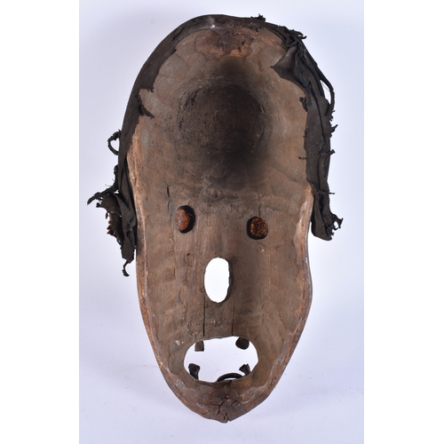 356 - AN UNUSUAL AFRICAN TRIBAL CARVED WOOD MONKEY MASK. 38 cm x 15 cm.