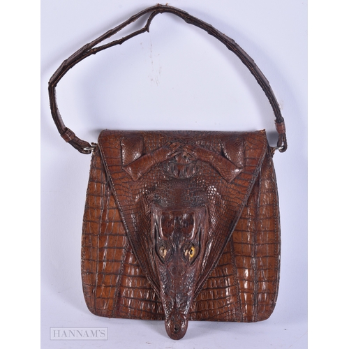 358 - A CHARMING EDWARDIAN NOVELTY BABY ALLIGATOR LEATHER SKIN BAG with glass eyes. 15 cm x 15 cm excludin... 