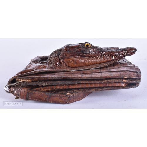 358 - A CHARMING EDWARDIAN NOVELTY BABY ALLIGATOR LEATHER SKIN BAG with glass eyes. 15 cm x 15 cm excludin... 