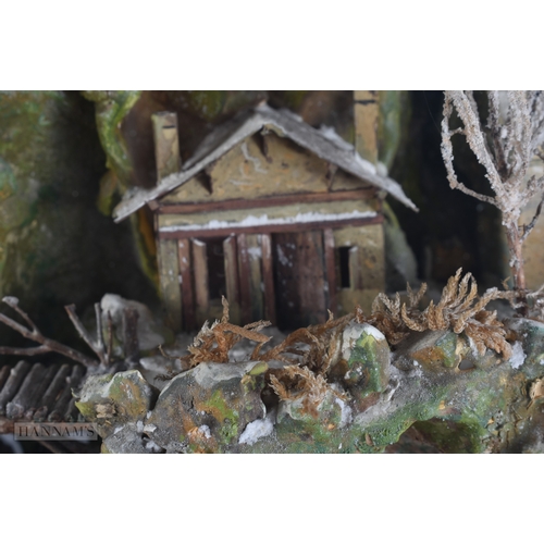 362 - A RARE VICTORIAN GLASS CASED MOUNTAIN RANGE DIORAMA depicting figures in various pursuits. 62 cm x 5... 