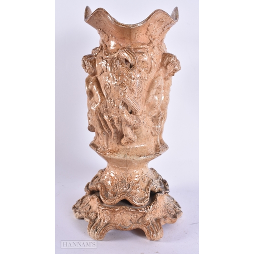 365 - A RARE LARGE EARLY 19TH CENTURY ENGLISH STONEWARE TWIN HANDLED VASE decorated in relief with putti o... 