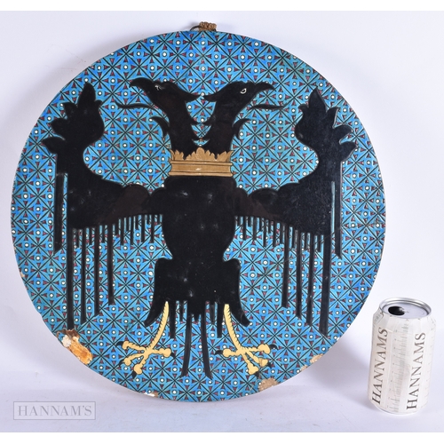 369 - A VERY RARE 19TH CENTURY FRENCH POTTERY DOUBLE EAGLE POTTERY PLAQUE possibly Longwy. 39 cm diameter.