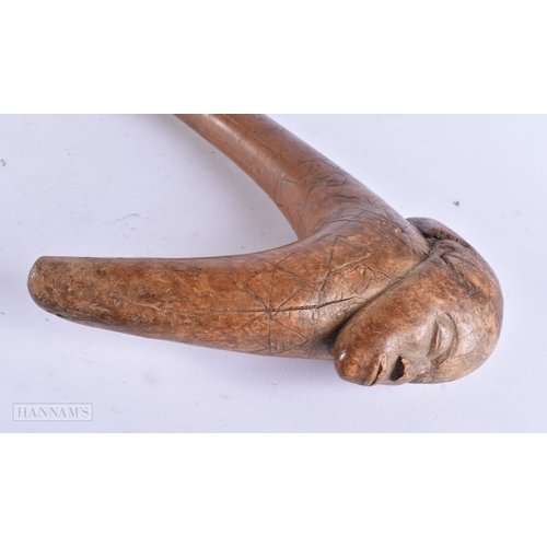372 - AN UNUSUAL AFRICAN TRIBAL DOUBLE HEADED THROWING CLUB with engraved motifs. 60 cm long,