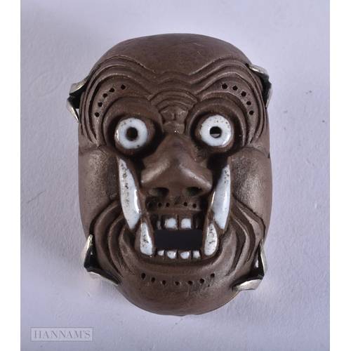 375 - AN UNUSUAL 19TH CENTURY JAPANESE MEIJI PERIOD POTTERY MASK NETSUKE. 4.5 cm x 3.5 cm.