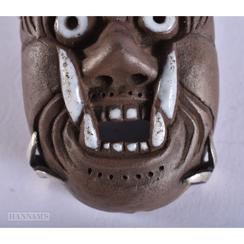 375 - AN UNUSUAL 19TH CENTURY JAPANESE MEIJI PERIOD POTTERY MASK NETSUKE. 4.5 cm x 3.5 cm.