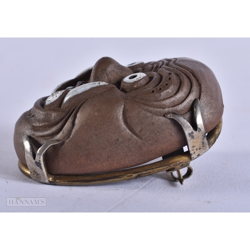 375 - AN UNUSUAL 19TH CENTURY JAPANESE MEIJI PERIOD POTTERY MASK NETSUKE. 4.5 cm x 3.5 cm.