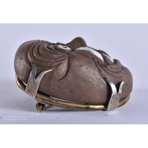 375 - AN UNUSUAL 19TH CENTURY JAPANESE MEIJI PERIOD POTTERY MASK NETSUKE. 4.5 cm x 3.5 cm.