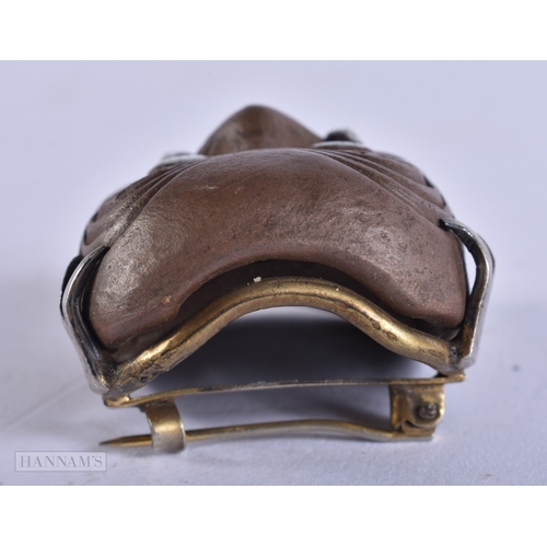 375 - AN UNUSUAL 19TH CENTURY JAPANESE MEIJI PERIOD POTTERY MASK NETSUKE. 4.5 cm x 3.5 cm.