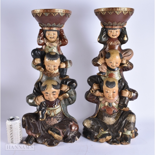 376 - A LARGE AND UNUSUAL PAIR OF 19TH CENTURY JAPANESE MEIJI PERIOD POTTERY FIGURES modelled as a family ... 