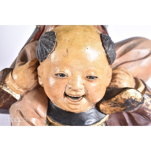 376 - A LARGE AND UNUSUAL PAIR OF 19TH CENTURY JAPANESE MEIJI PERIOD POTTERY FIGURES modelled as a family ... 