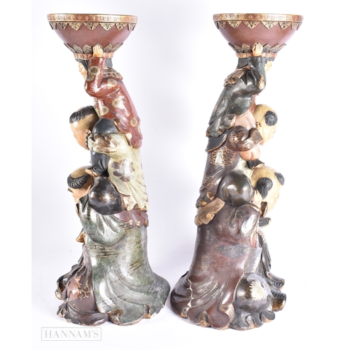 376 - A LARGE AND UNUSUAL PAIR OF 19TH CENTURY JAPANESE MEIJI PERIOD POTTERY FIGURES modelled as a family ... 