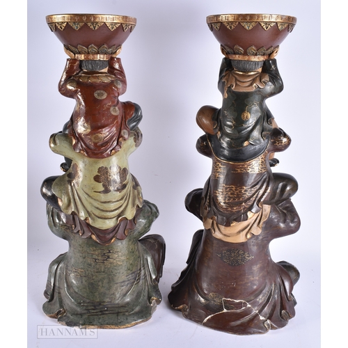376 - A LARGE AND UNUSUAL PAIR OF 19TH CENTURY JAPANESE MEIJI PERIOD POTTERY FIGURES modelled as a family ... 