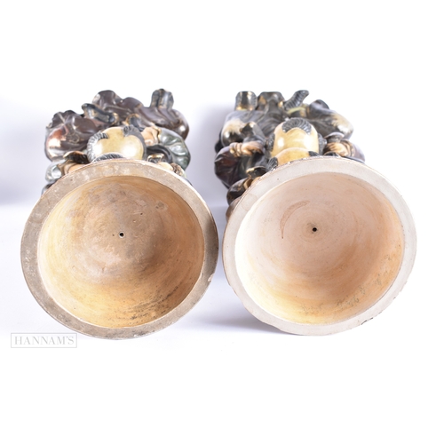 376 - A LARGE AND UNUSUAL PAIR OF 19TH CENTURY JAPANESE MEIJI PERIOD POTTERY FIGURES modelled as a family ... 