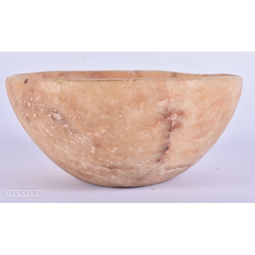 38 - AN EARLY EGYPTIAN MIDDLE EASTERN CARVED ALABASTER BOWL. 14 cm diameter.