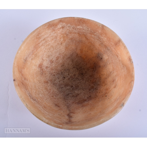 38 - AN EARLY EGYPTIAN MIDDLE EASTERN CARVED ALABASTER BOWL. 14 cm diameter.
