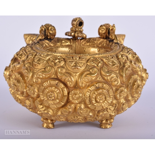 384 - A LARGE ANTIQUE INDIAN YELLOW METAL WEDDING CEREMONIAL BANGLE. 692 grams. Internal width 6.25 cm.