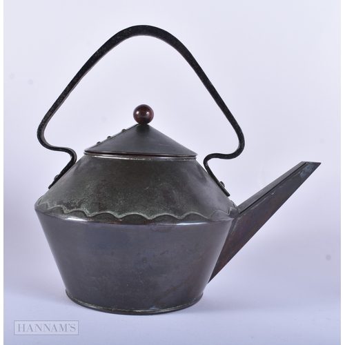 40 - A SYLISH ARTS AND CRAFTS COPPER AND IRON TEAPOT AND COVER. 21 cm x 18 cm.