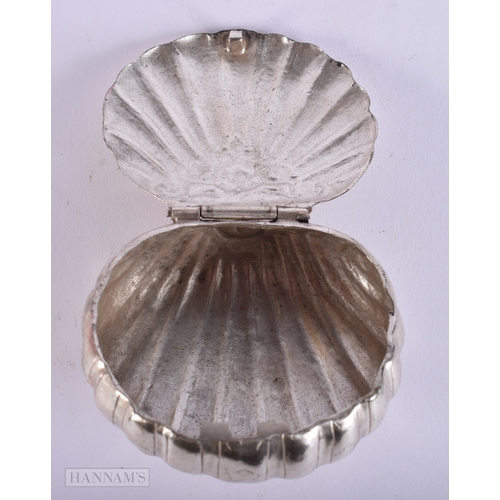 402 - AN ANTIQUE WHITE METAL CLAM SHELL SNUFF BOX. 36 grams. 5 cm x 6 cm.