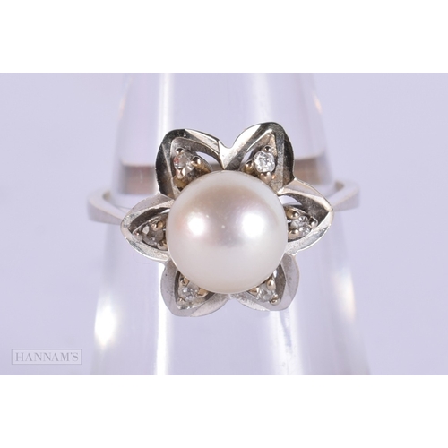 407 - AN 18CT GOLD DIAMOND AND PEARL RING. M. 4.2 grams.