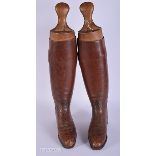 409 - A vintage pair of Riding boots together with a Alkit wooden lasts 56cm.