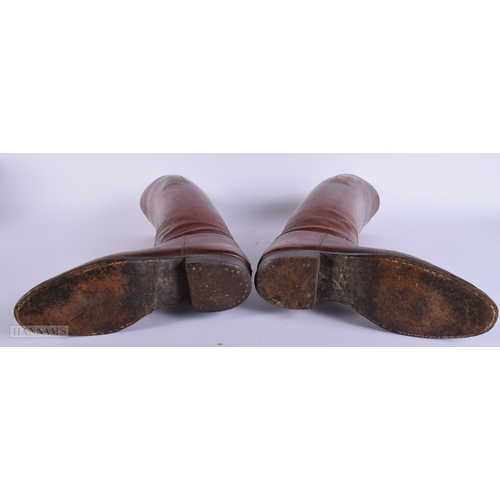 409 - A vintage pair of Riding boots together with a Alkit wooden lasts 56cm.