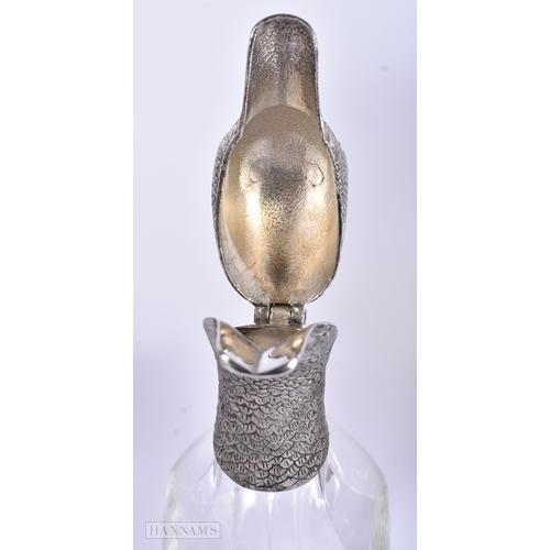 41 - A VINTAGE SILVER PLATED GLASS DUCK HEAD DECANTER together with a smokey glass decanter. Largest 27 c... 