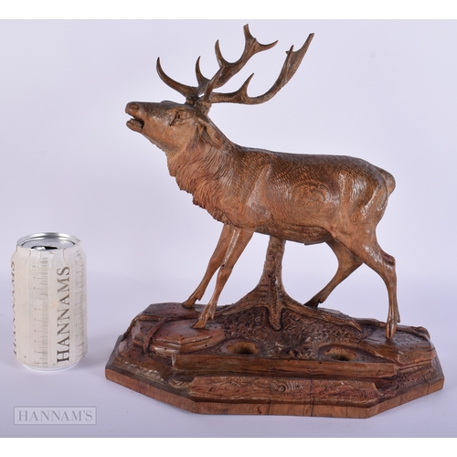 412 - A LARGE 19TH CENTURY BAVARIAN BLACK FOREST CARVED WOOD STAG. Signed. 32 cm x 27 cm.