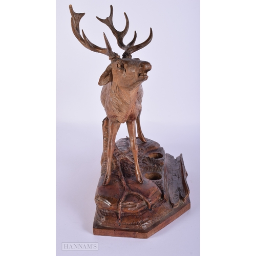 412 - A LARGE 19TH CENTURY BAVARIAN BLACK FOREST CARVED WOOD STAG. Signed. 32 cm x 27 cm.