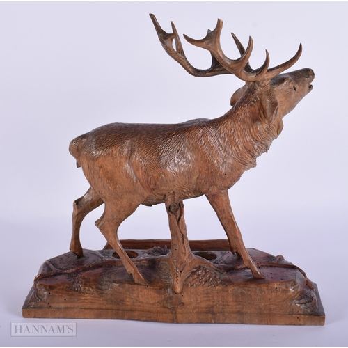 412 - A LARGE 19TH CENTURY BAVARIAN BLACK FOREST CARVED WOOD STAG. Signed. 32 cm x 27 cm.