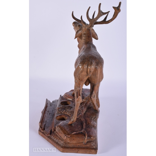 412 - A LARGE 19TH CENTURY BAVARIAN BLACK FOREST CARVED WOOD STAG. Signed. 32 cm x 27 cm.