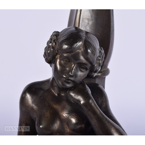 413 - AN ART DECO SPELTER FIGURAL LAMP. 32 cm high.